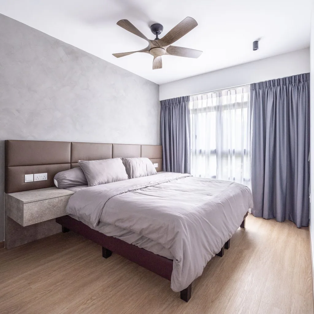 Minimalist bedroom with double bed, ceiling fan, and large window